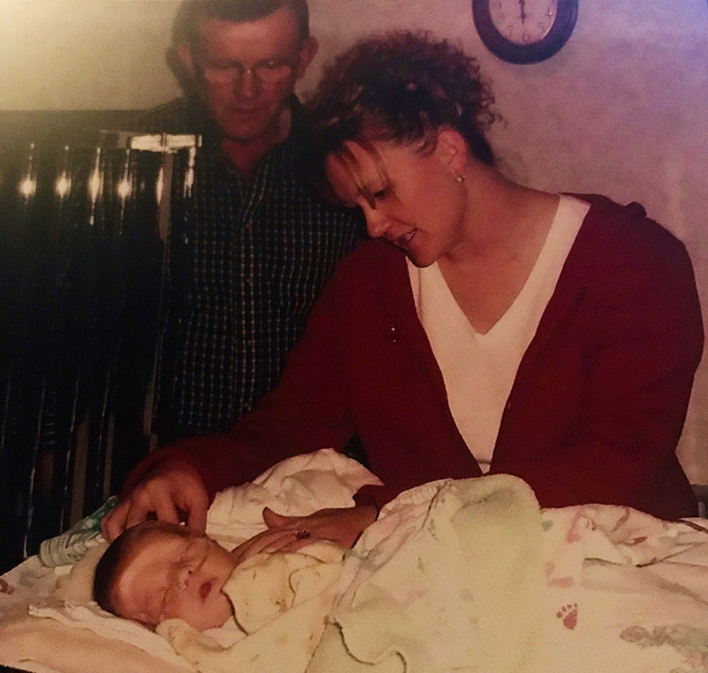 parents looking over their baby